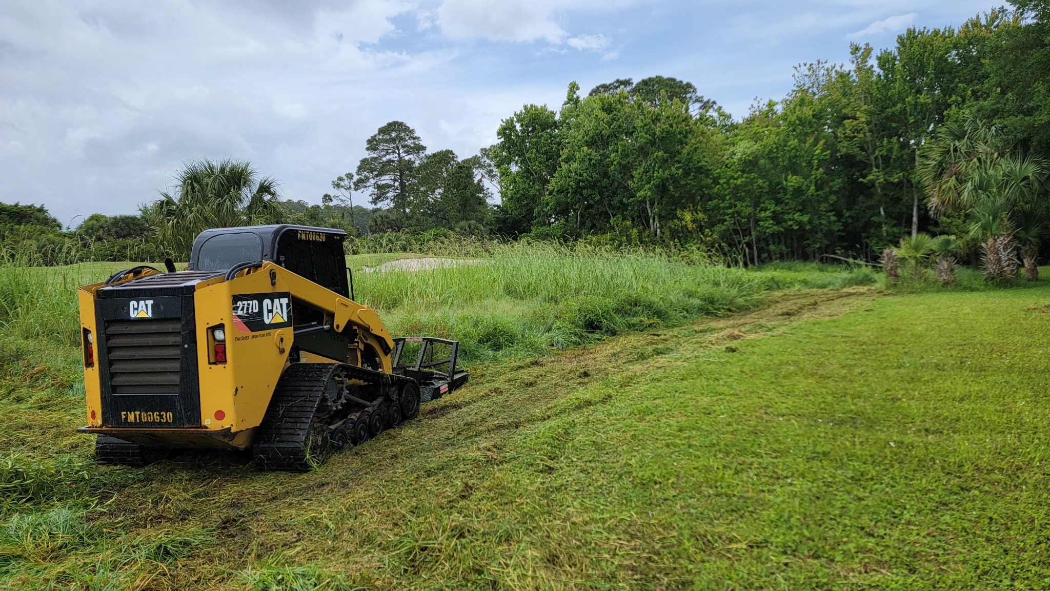 Clearing an overgrown vacant platted lot in Deltona