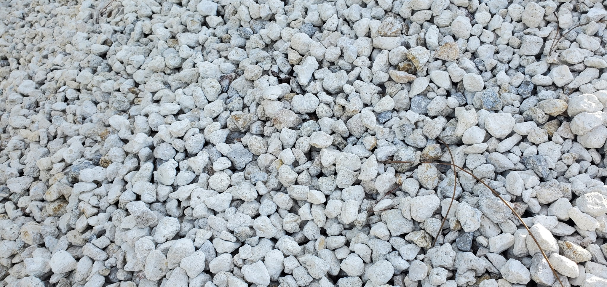 Close-up of compacted base rock material for a driveway