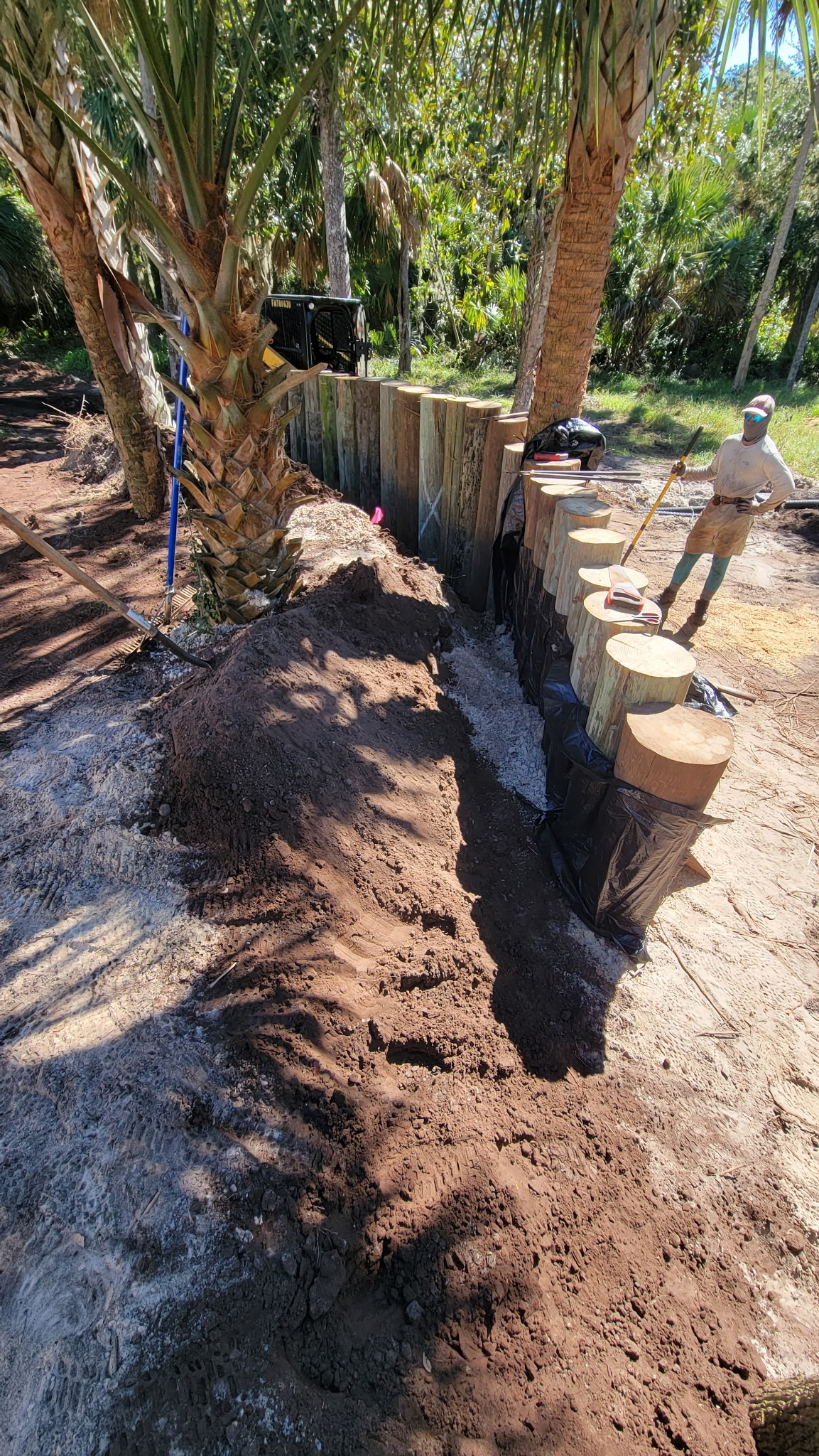 Crew grading a beachside yard near A1A in Flagler Beach