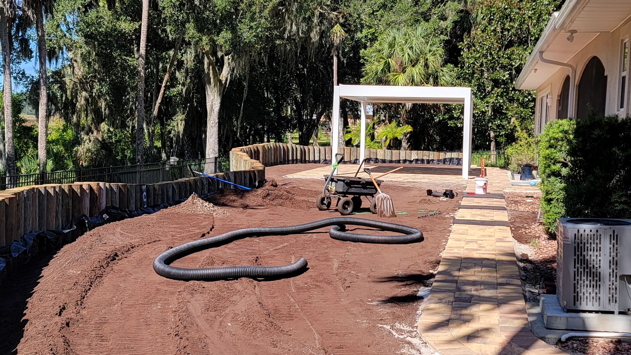 Yard regrading to restore drainage slope on a Deltona property